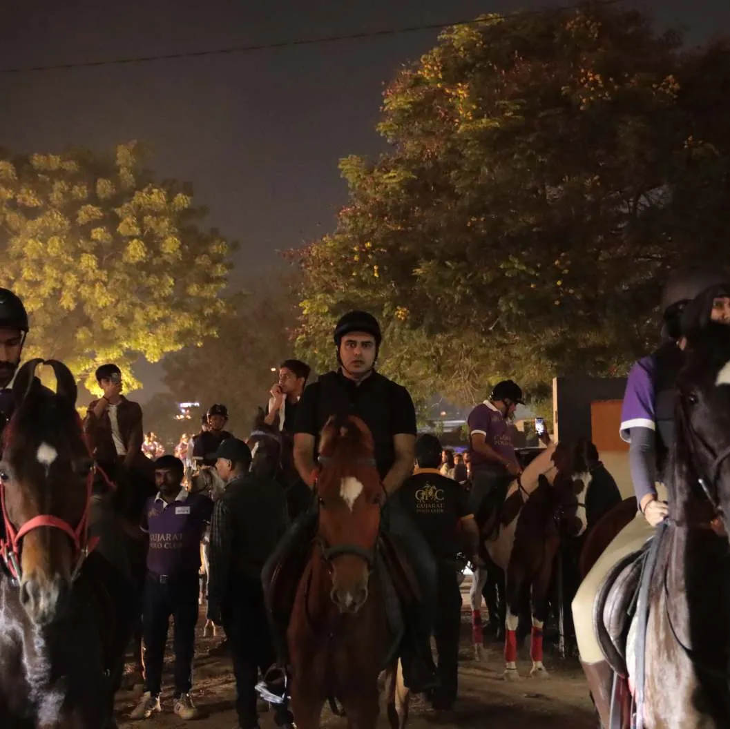 Young riders in purple lead the road show through the city